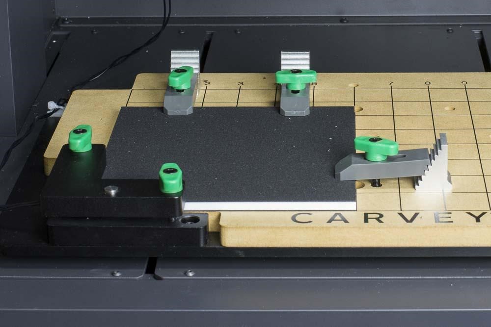 http://carvey-instructions.inventables.com/easel/clamped_material.jpg